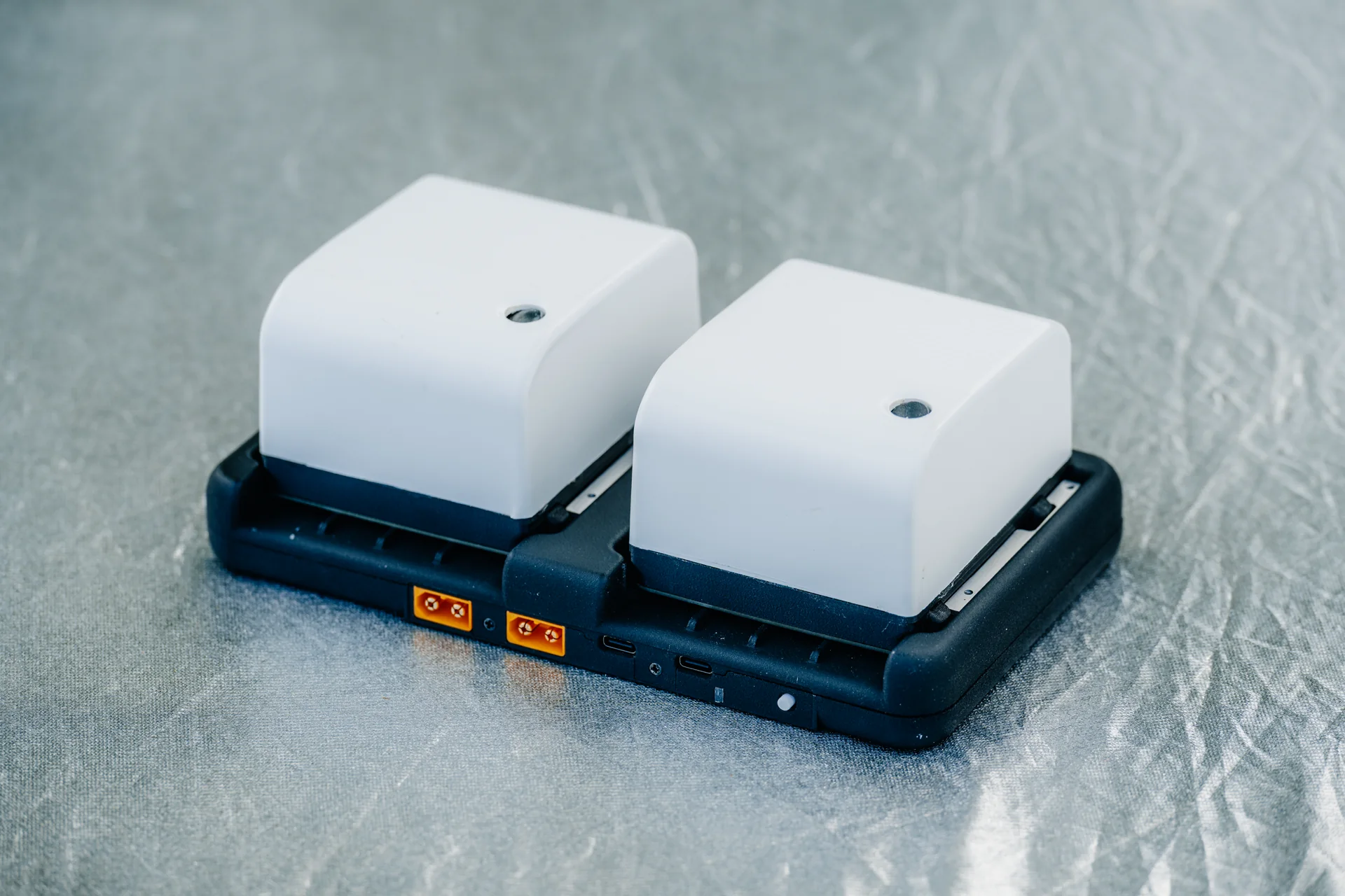 Compact electronics module on a dark base